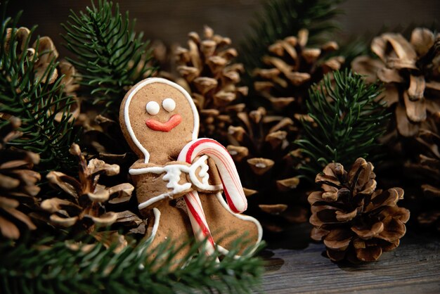 Gingerbread men laying on wood background. Christmas or New Year composition.