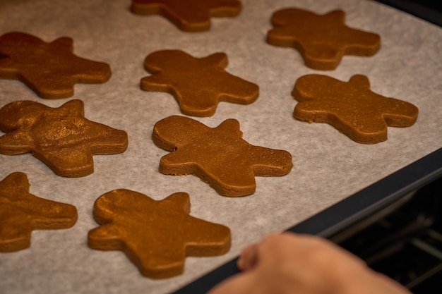 Gingerbread men on the tray ready to go in the oven