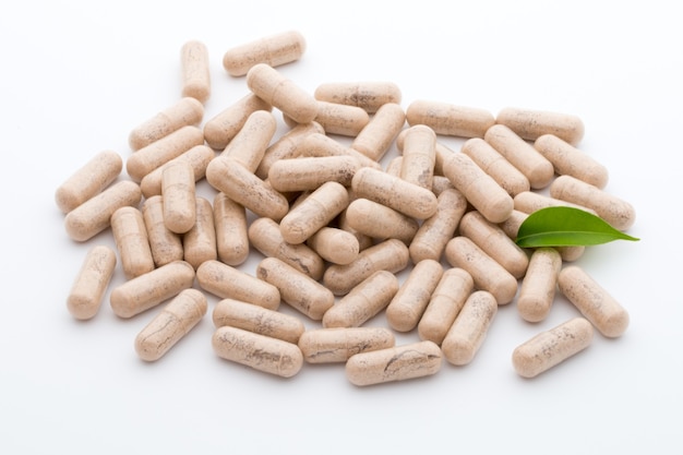 Ginkgo capsules and a leaf