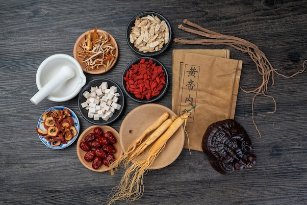 Ginseng and traditional Chinese medicine on the table.