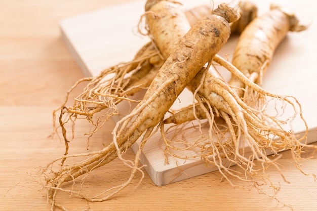 Ginseng on wood background