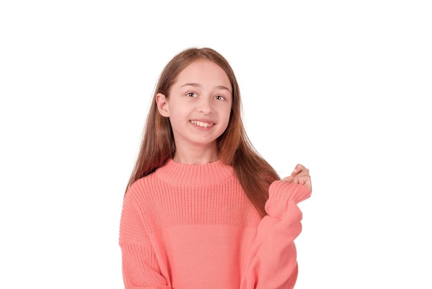 Girl 11 years old in a pink sweater isolated on white Portrait of a teenage girl