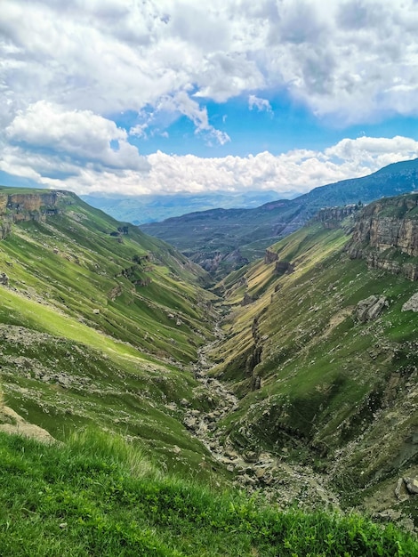 A girl against the background of the Khunzakh valley Khunzakh waterfalls a canyon in Dagestan 2021