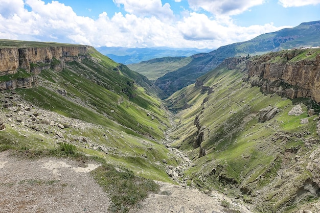 A girl against the background of the Khunzakh valley Khunzakh waterfalls a canyon in Dagestan 2021