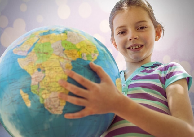 Girl against sparkling background with world globe