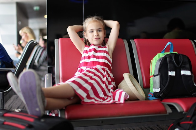 Girl in airport during her summer travel