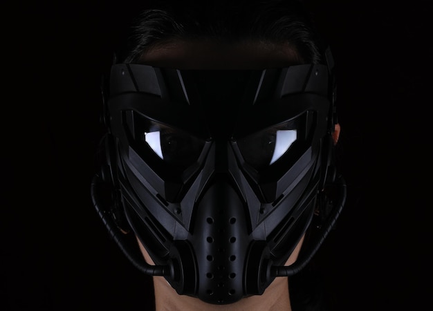 girl in an apocalypse mask on a black background