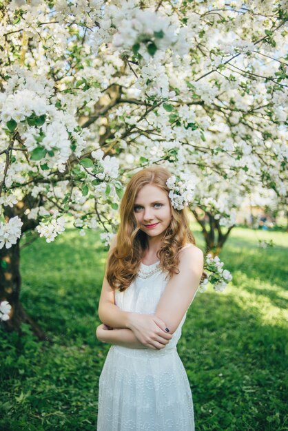 A girl in an apple orchard