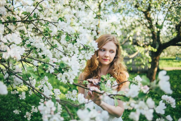 A girl in an apple orchard