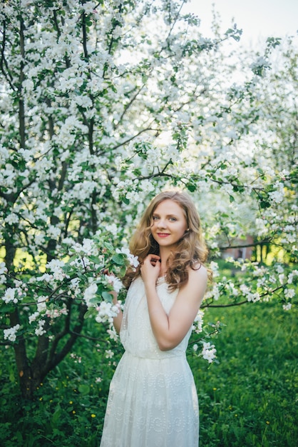 A girl in an apple orchard