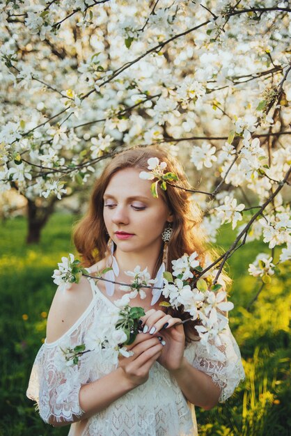 A girl in an apple orchard