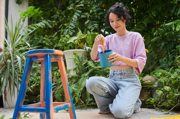 Girl Applying Pain on Chair