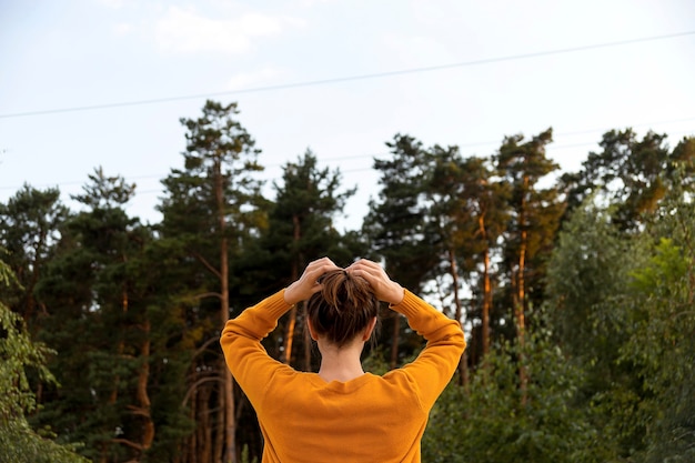 Girl in the autumn in nature enjoys mindfulness