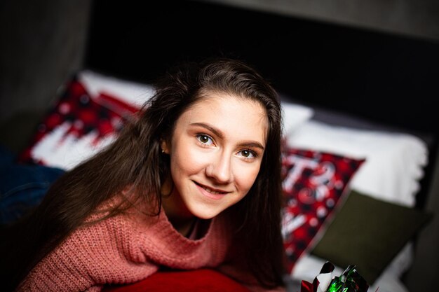 Girl on the background of the Christmas tree.