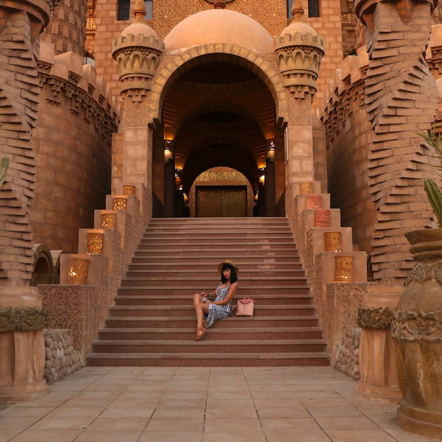 girl on the background of the El Mustafa Mosque in the Old City of Egypt Travel to Egypt concept