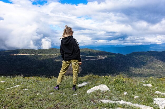 A girl on the background of the LagoNaki plateau in Adygea Russia