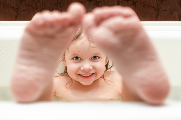 Girl bathes in the bathroom