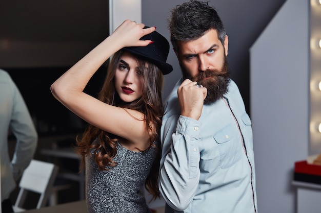 Girl and bearded guy or happy lovers on a date