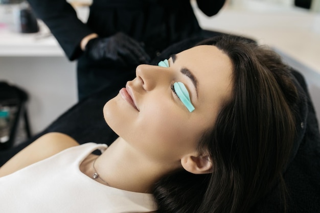 A girl in a beauty salon A girl is undergoing an eyelash lamination procedure