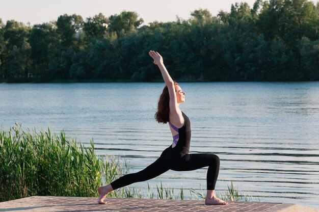 Girl beauty yoga sunrise lake outdoors