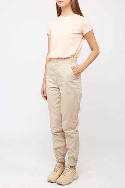 Girl in beige cargo pants and a t-shirt