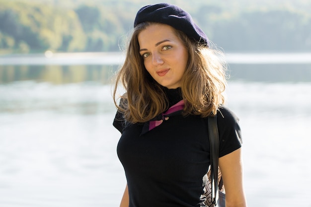 The girl in beret and skirt in the park