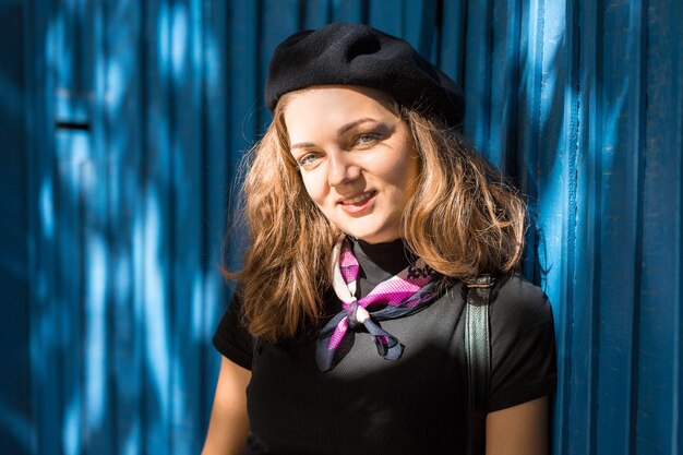 The girl in beret and skirt in the park