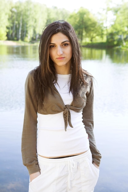 Girl beside a lake