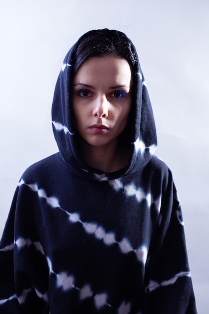 girl in a black sweatshirt portrait on a white background