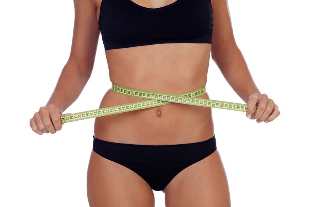 Girl in black underwear with a tape measure around her waist 