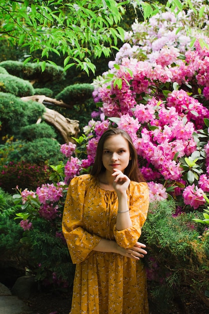 Girl in a blooming garden