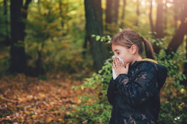 Girl blowing her nose