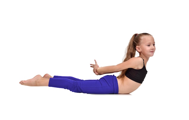 Girl in blue clothing doing yoga exercises