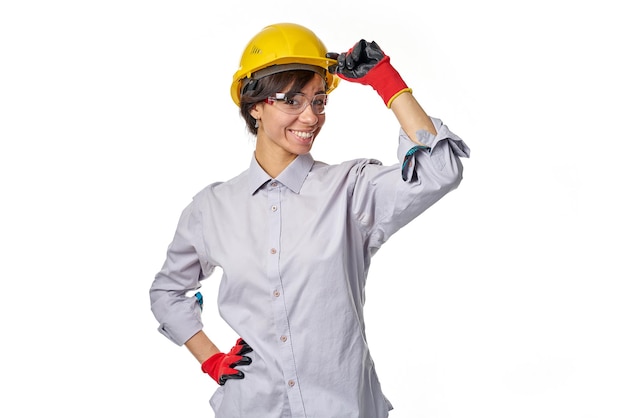 Girl builder with a ruler on a white background