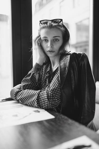 girl in cafe, black and white