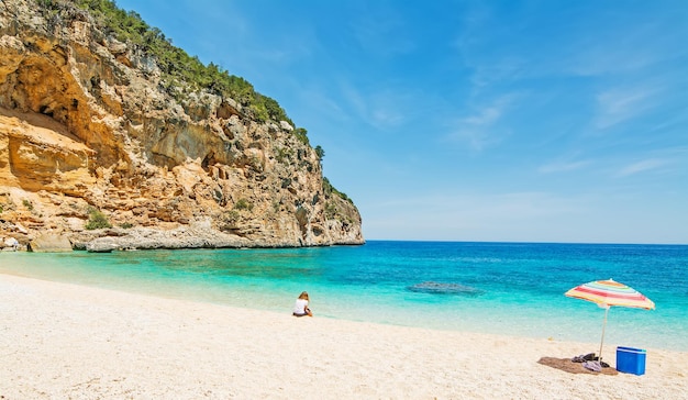 Girl in Cala Biriola on a clear day Sardinia