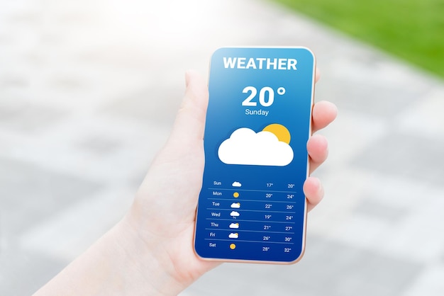 The girl checks the weather forecast in a mobile application