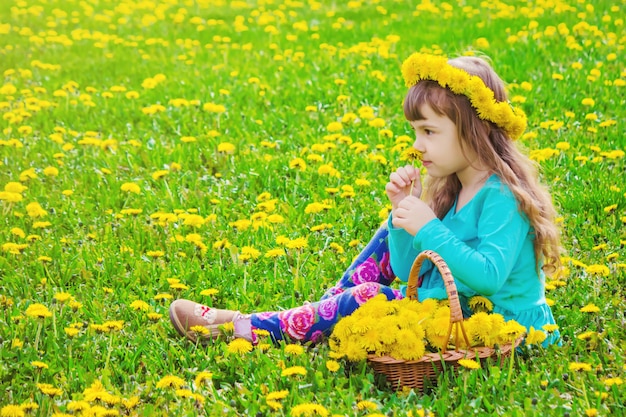 Girl, child, flowers in the spring plays. 