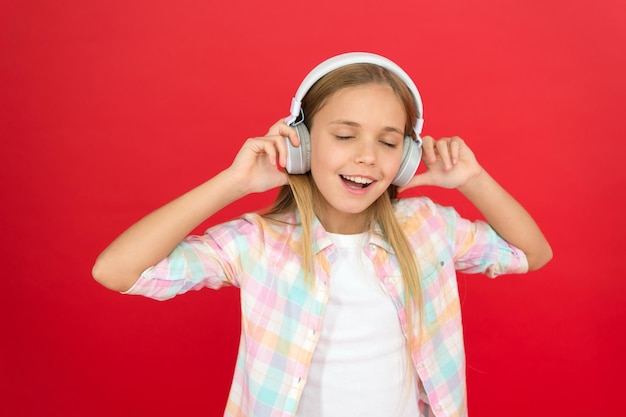 Girl child listen music modern headphones Get music account subscription Enjoy music concept Music always with me Leisure concept Little girl listen song headphones Online radio station channel