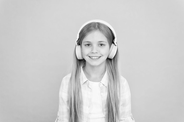 Girl child listen music with modern headphones kid little girl\
listen music headphones music account playlist customize your music\
listen track for dancing learn song lyrics clear sound