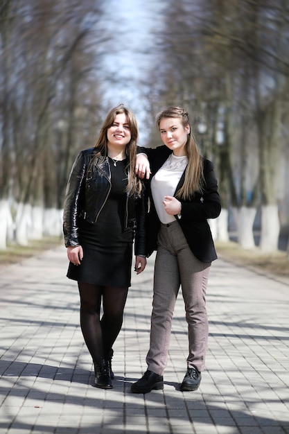 Girl in the city park for a walk casual clothes