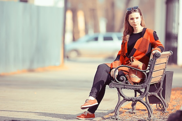 girl in coat outdoor / autumn photo model girl adult posing in park, girl in coat with long hair