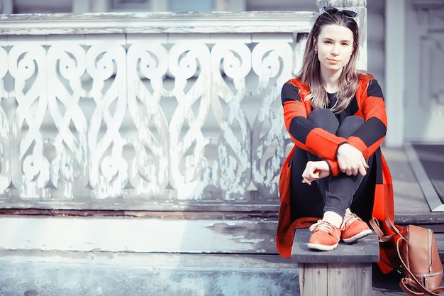 girl in coat outdoor / autumn photo model girl adult posing in park, girl in coat with long hair