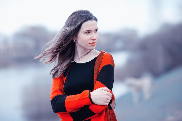 girl in coat outdoor / autumn photo model girl adult posing in park, girl in coat with long hair