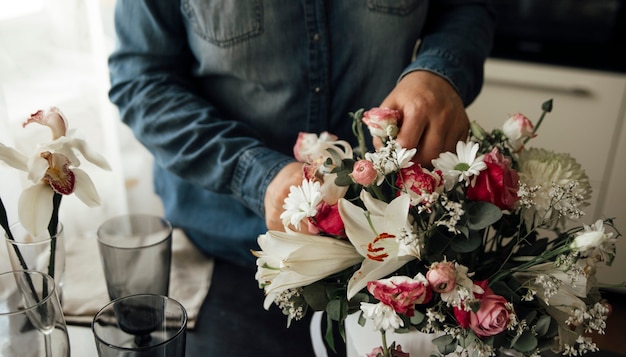 the girl collects a beautiful bouquet of flowers