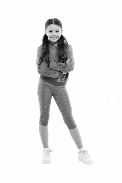 Girl cute kid with long ponytails wear sportive costume isolated on white Sport for girls Guidance on working out with long hair Deal with long hair while exercising Working out with long hair