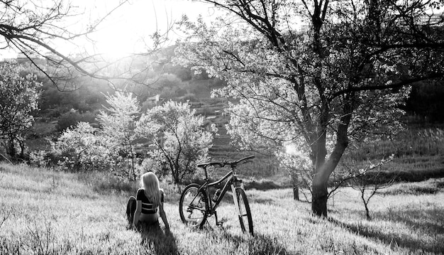 Girl cyclist in nature