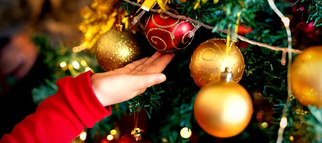 Girl decorating Christmas tree