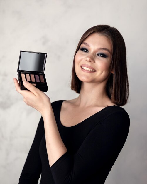 Girl demonstrates a set of cosmetics