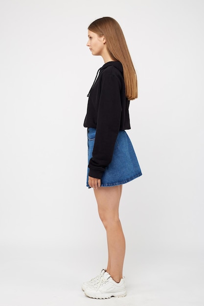 Girl in a denim skirt and a black jacket